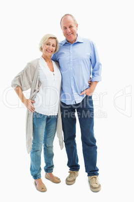 Happy mature couple hugging and smiling