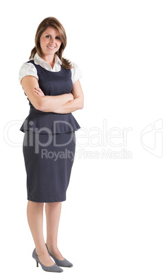 Beautiful young businesswoman with arms crossed