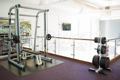 Empty weights room with bench press