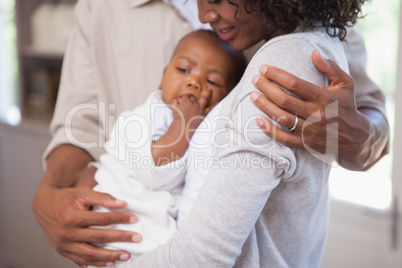 Happy parents spending time with baby