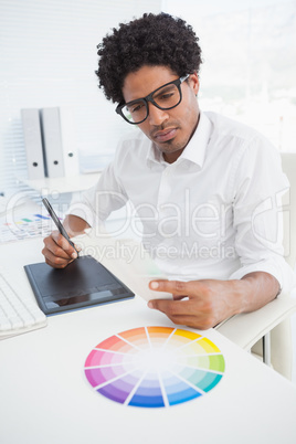 Hipster designer working at his desk