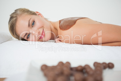 Beautiful blonde enjoying a chocolate beauty treatment