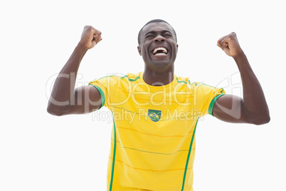 Cheering brazilian football fan in yellow