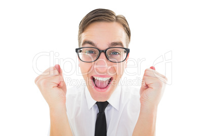 Geeky young hipster cheering at camera