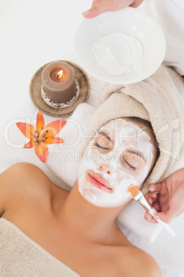 Attractive woman receiving treatment at spa center