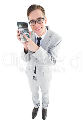 Geeky smiling businessman showing calculator