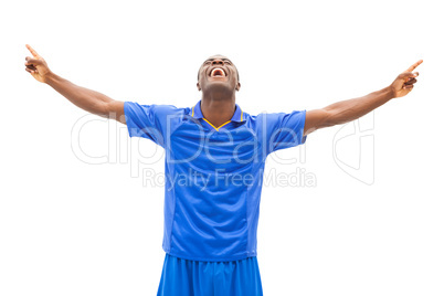 Excited football player in blue cheering