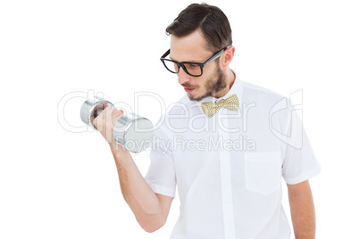 Geeky businessman lifting heavy dumbbell
