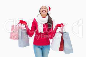 Beautiful festive woman holding shopping bags
