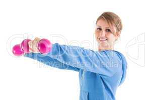 Smiling young woman with dumbbells