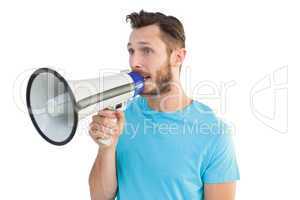 Handsome hipster talking through megaphone