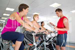Trainer talking with his spin class