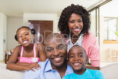 Happy family relaxing on the couch