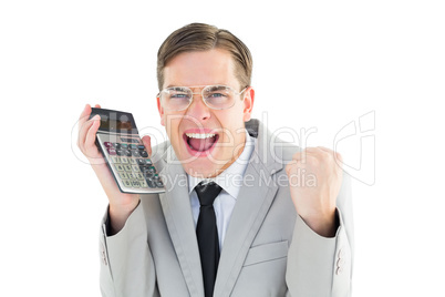 Geeky smiling businessman holding calculator