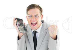 Geeky smiling businessman holding calculator