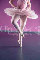 Graceful ballerina dancing en pointe