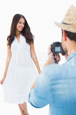 Hipster taking a photo of pretty girlfriend