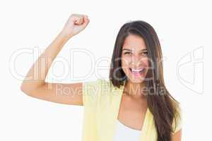 Happy casual woman cheering at camera