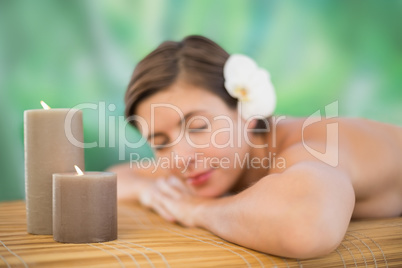 Beautiful young woman on massage table