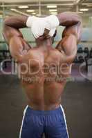 Bodybuilder posing in gym