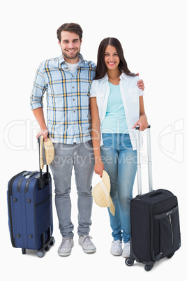 Attractive young couple going on their holidays