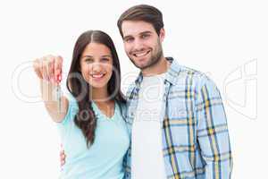 Happy young couple showing new house key