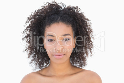 Pretty girl with afro hairstyle smiling at camera