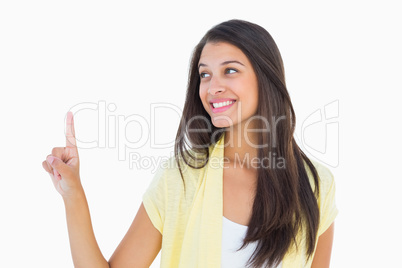 Happy casual woman pointing up