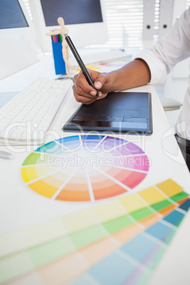 Designer working at desk using digitizer