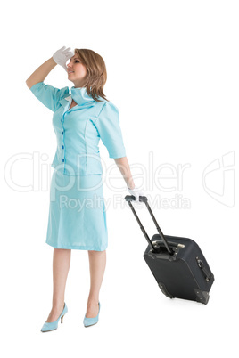 Stewardess in blue uniform with her bag