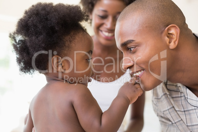 Happy parents with their baby girl