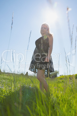 Pretty blonde in sundress smiling at camera