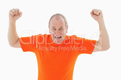 Mature man in orange tshirt cheering