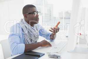 Hipster businessman working at his desk