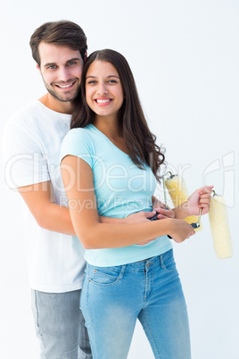 Happy young couple painting together