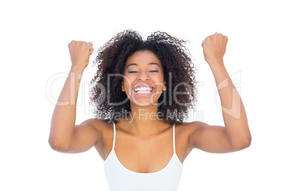 Pretty girl in white top cheering at camera