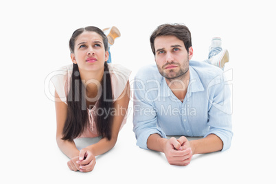 Attractive young couple looking up
