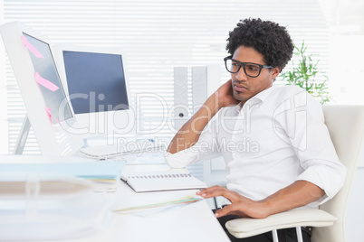 Hipster businessman working at his desk