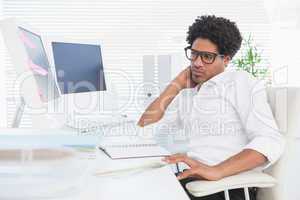 Hipster businessman working at his desk