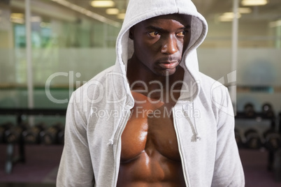 Muscular man in hood jacket