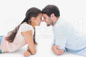 Attractive young couple smiling at each other
