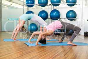 Women in crab pose in fitness studio