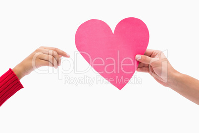 Man passing woman pink heart