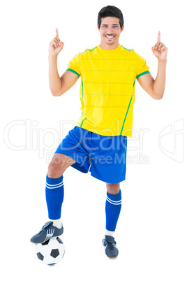 Football player in yellow with ball