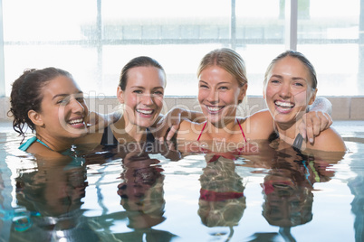 Female fitness class smiling at camera