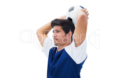 Football player in white throwing ball