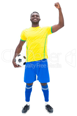 Football player in yellow celebrating a win