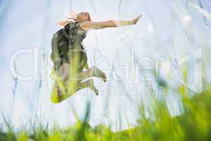 Pretty blonde in sundress jumping up