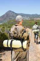 Hiking couple walking on mountain trail