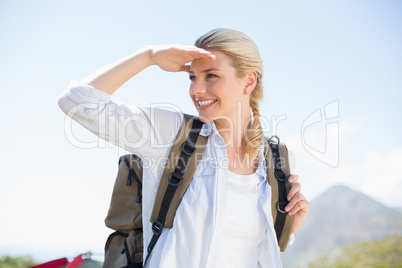 Attractive hiking blonde looking around